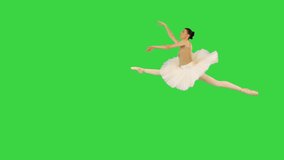 Young ballerina performing grand jete on a Green Screen, Chroma Key. - Powered by Shutterstock - Get 15% off with code: PIKWIZARD15
