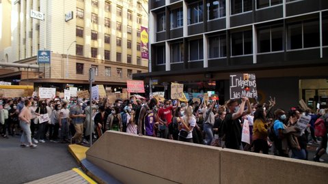BRISBANE, QUEENSLAND, AUSTRALIA. JUNE 06 2020.Clapping Black Lives Matter demonstrators at Anzac Square.