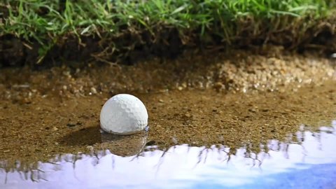 golf ball falling into water hazard