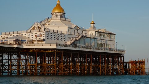 EASTBOURNE, circa 2021 - Close-up of the Eastbourne Pier in Eastbourne, East Sussex, England, a fashionable tourist seaside resort, east of Beachy Head