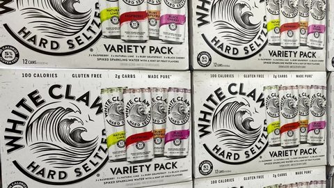 Orlando, FL - USA February 6, 2021: Panning up on cases of White Claw Hard Seltzer at a Sams Club store.