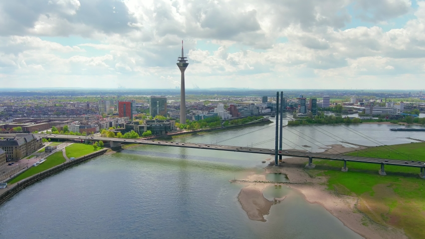 Dusseldorf: Aerial view of city in Germany, skyline with bridge over river Rhine - landscape panorama of Europe from above Royalty-Free Stock Footage #1075663106