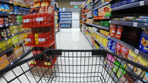 4K footage video of time warp or timelapse of shopping the the supermarket hypermarket which presented in point of shopping cart view