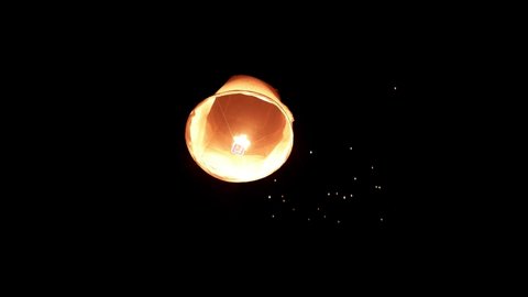 Thousands of glowing sky lanterns are released into the night sky to wish for good luck as part of a lantern festival.