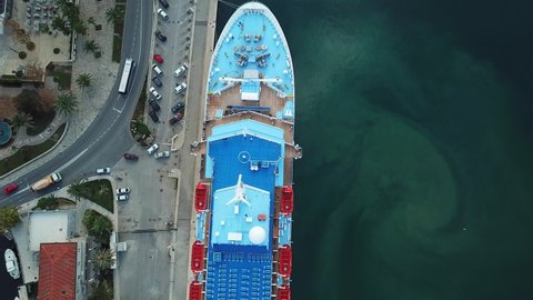 Kotor, Montenegro - September 2019: Top view aerial of a large international luxury Tui cruise liner ship docked in the Adriatic Sea marina of Kotor Boko Bay, Montenegro, Europe