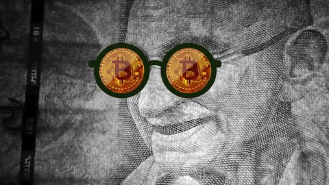 Bitcoin symbol in Gandhi ji's glasses, Indian currency, Mumbai, India, 10 July 2021