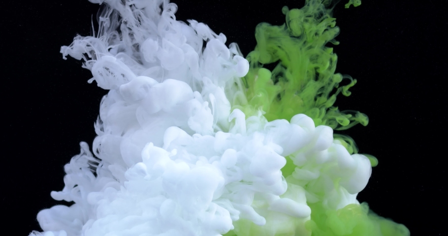 Color paint drops in water, abstract colors mix of Ink color paint falling on water, Abstarct colorful rainbow ink paint in the water. Slow motion of Liquid ink isolated. 8K downscale