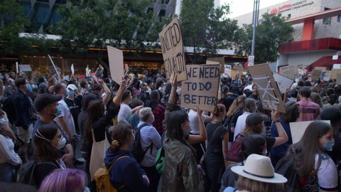 BRISBANE, QUEENSLAND, AUSTRALIA. JUNE 06 2020. 'We Need To Do Better' placard at Black Lives Matter demonstration,  slow motion.