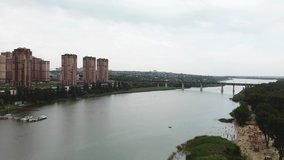 a large river on the background of the city is an aerial view. video from a quadrocopter
