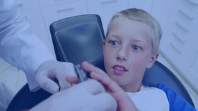 Animation of data processing over boy in dentist chair. global medicine, connections and technology concept digitally generated video.