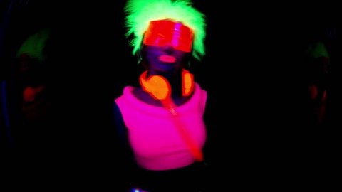 4k fantastic video of sexy cyber raver dancer babe filmed in fluorescent clothing under UV black light
