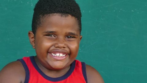Portrait of happy children with emotions and feelings. African american young boy smiling, looking at camera with joyful smile, male child with glad expression on face. Closeup, copy space