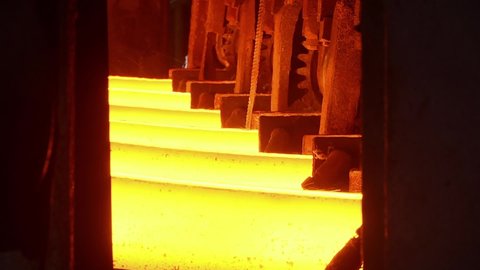 Continuous casting process. Steel production in the workshop. Hot steel pouring in steel plant. Hot ingot after molten steel casting
