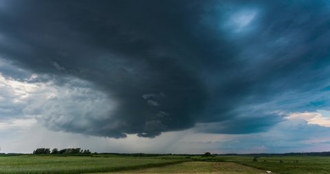 Time lapse of tornado warned supercell storm rolling through the fields in Lithuania, giant rotating wall cloud