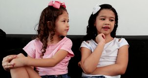 Two little girl speaking to camera in video conference. small sisters recording video