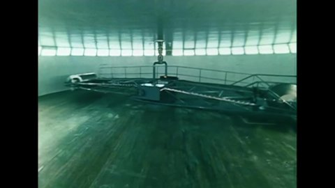 CIRCA 1968 - A centrifuge for Russian astronaut training spins around a giant room.