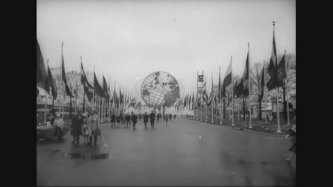 CIRCA 1964 - It rains on opening day of the New York World's Fair, but visitors still arrive and ride the Skyway.