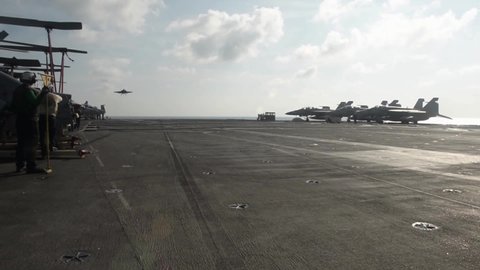 CIRCA 2021 Flight operations and fighter jet landing on the deck of the USS Theodore Roosevelt in the South China Sea.