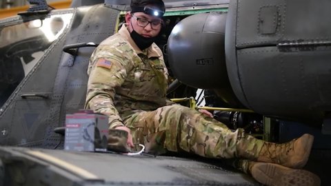 CIRCA 2021 Ground mechanics, electrician crews maintain 12th Combat Aviation Brigade AH-64 Apache helicopters, Germany.