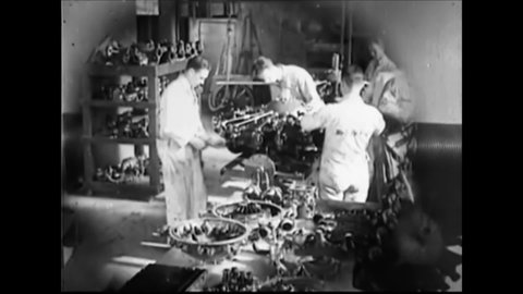 CIRCA 1920s - Charles Lindbergh inspects airplane engines in a factory, and passengers board a small plane.