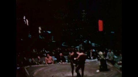 CIRCA 1959 - A sumo wrestling match begins in Tokyo, Japan.