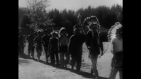 CIRCA 1935 - Pageants at Minnesota's Itasca Lake State Park and Scenic State Park show visitors the history of the area's Ojibwe tribe.