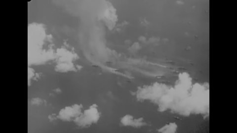 CIRCA 1946 - Excellent aerial view of smoke rising from an atomic mushroom cloud at the Bikini Atoll.