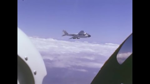 CIRCA 1960 - A US Navy pilot watches an A-6 fly past his cockpit.