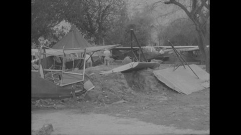 CIRCA 1944 - US Army Air force TG 5 fighters and huts have been destroyed by a severe storm on the Tezgaon Air Base in India.