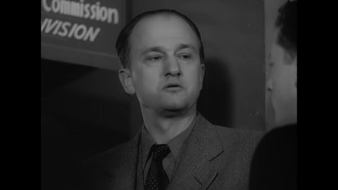 CIRCA 1940s - Slovene-American writer Louis Adamic talks to the advisory council of the National Defense Commission's Consumer Division.