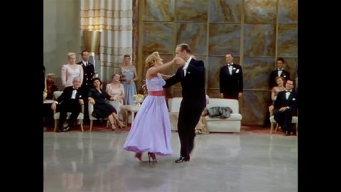 CIRCA 1951 - In this musical, a man (Fred Astaire) dances with a woman to entertain party guests.