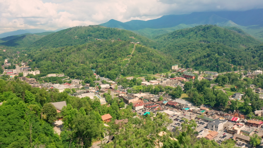 Aerial view of Gatlinburg with slow camera rotation. Gatlinburg is a popular mountain resort city in Sevier County, Tennessee, as it rests on the border of Great Smoky Mountains National Park.