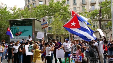 12 July 2021. Barcelona, Spain. Cuban community protesting on the streets of Paseo de Gracia in front of the consulate embassy. Rally, flags and cartels against Fidel Castro dictatorship. People dance