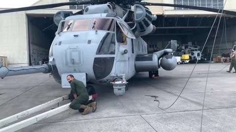 CIRCA 2021 U.S. Marine Aircraft Wing conduct aircraft maintenance and pre-flight inspections, CH-53E Super Stallion heavy lift helicopter.