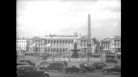 CIRCA 1940s - One of the Luxor Obelisks in the Place de la Concorde, the Notre Dame cathedral, and the Arc de Triomphe in Paris, France.