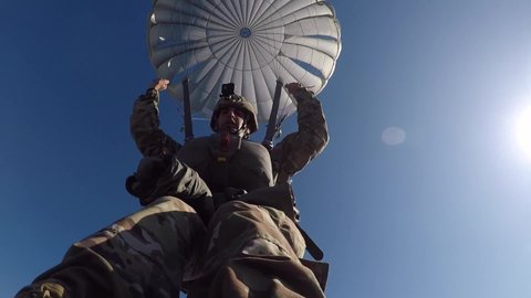 CIRCA 2019 U.S. Army Ranger special forces soldiers jump from helicopter during a military training parachute jump, Georgia.