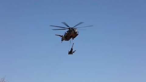 CIRCA 2019 U.S. Marines Sikorsky CH-53E Super Stallion helicopter delivers heavy weapons and soldiers, military exercise.