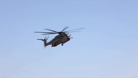 CIRCA 2019 U.S. Marines Sikorsky CH-53E Super Stallion helicopter flys, takes off, and lifts heavy weapons, military exercise.