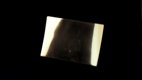 Isolated metal plate with abstract texture rotating on a black background. Abstract reflection on copper plate - Powered by Shutterstock - Get 15% off with code: PIKWIZARD15