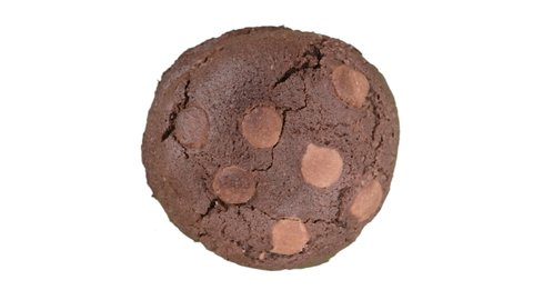 Brown peanut butter chocolate cookie spinning on white background