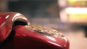 Dialing numbers on old red vintage retro rotary phone, closeup. - Powered by Shutterstock - Get 15% off with code: PIKWIZARD15