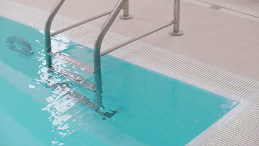 Close up of swimming pool ladder steps Royalty-Free Stock Footage #1075818104