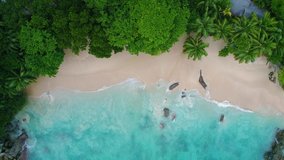 Video from a drone in the Seychelles on a beach called 