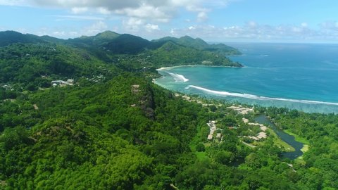 Video from a drone in the Seychelles, the drone flies high above Baie Lazare