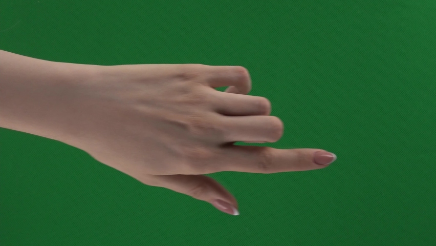 Package of gestures for controlling touch screen with female hand on green screen. Beautiful woman fingers with well-groomed manicure is ready for chroma keying. Set of arms for controlling touchpad.