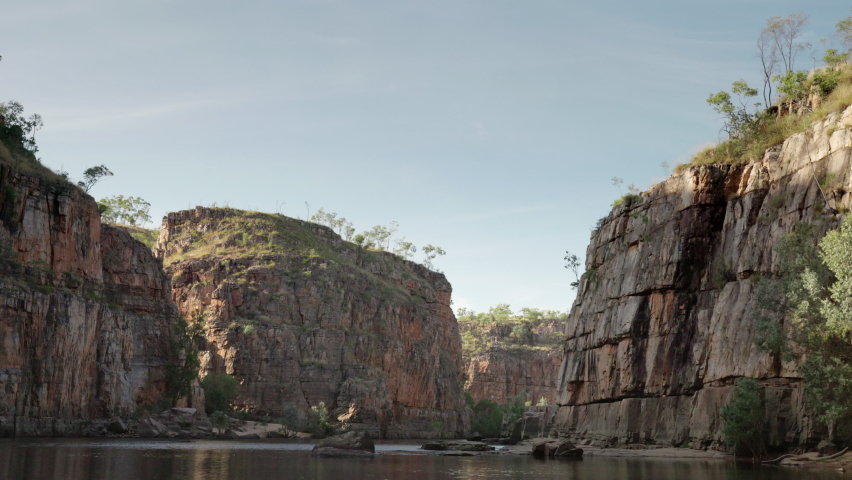 upstream view of cliffs in the second nitmiluk gorge, also known as katherine gorge at nitmiluk national park in the northern territory Royalty-Free Stock Footage #1075849784