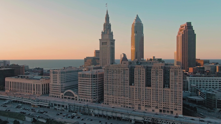 Aerial flying over downtown Cleveland at sunset, Ohio, USA Royalty-Free Stock Footage #1075850411