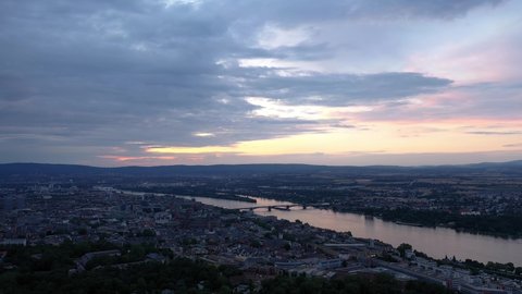 Magic Sky over Mainz at golden hour night with the cathedral and the dark Rhine river water in the background showing a colorful sky