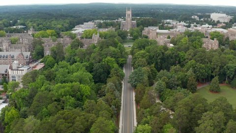 Durham , North Carolina , United States - 06 12 2021: Duke University, Duke Chapel. Long aerial dolly forward approach shot. Drone view.