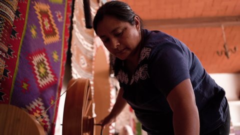 Woman making traditional Mexican fabrics
